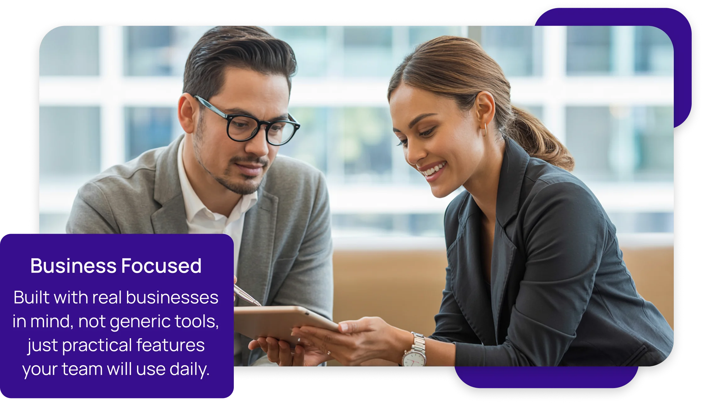 image of Man and woman engaged in a discussion while looking at a tablet